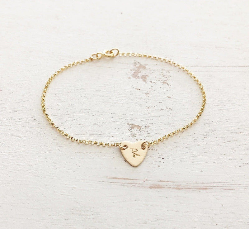 gold heart initial bracelet